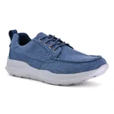 Zapato casual color beige con cordones y suela gruesa.