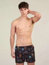 Bóxer de algodón blanco con estampado de flores pequeñas color celeste, con cintura elástica y logo de la marca en el centro.