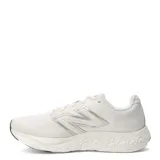 Championes New Balance 680 V8 para mujer, color beige con detalles en plateado y negro. Capellada de mesh técnico transpirable con refuerzos, entresuela Fresh Foam y suela de goma.