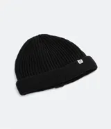 Gorro corto tipo beanie color beige, tejido en lana acrílica con textura acanalada.