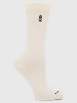 Calcetín de largo medio color crema, con puño suave (Comfort Cuff) y logo bordado de Hush Puppies en la parte superior.