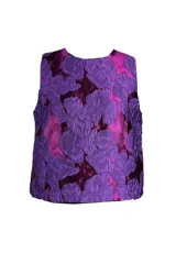 Top sin mangas de jacquard con patrón floral en relieve en tonos púrpura y fucsia.