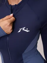 Malla entera manga larga con cierre frontal, combinada en negro y gris.