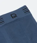 Calzoncillo bóxer blanco de poliamida, con cintura elástica a rayas grises y logo de la marca.