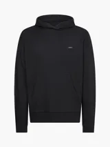 Buzo negro con capucha y bolsillo tipo canguro. Logo de Calvin Klein bordado en el pecho.