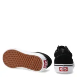 Championes Vans Old Skool negros con la clásica banda lateral blanca, confeccionados en lona y gamuza, con suela de goma blanca tipo waffle.