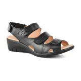 Sandalia de cuero sintético color celeste con plataforma marrón y ajuste con velcro.