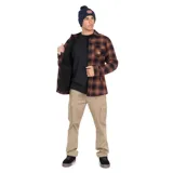 Camisa tipo chaqueta de franela a cuadros marrones y negros, con forro interior de tafeta. Tiene dos bolsillos con tapa en el pecho y dos bolsillos laterales.