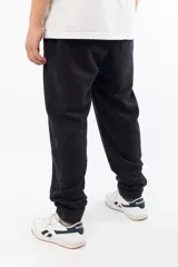 Pantalón de jogging negro de corte holgado con logo 'VERNAL' bordado en azul en el muslo izquierdo.