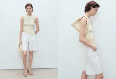 Short blanco de tiro medio con cierre de cremallera y botón, cinco bolsillos, diseño recto y bajo deshilachado.