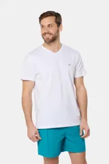 Short de baño azul vibrante, de corte clásico y largo medio, con cintura elástica y cordón ajustable. Cuenta con bolsillos laterales y suspensor de malla fina interior.