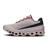 Championes de running On Cloudmonster, color lila con detalles en gris, negro, verde y rosa.