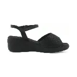 Sandalias negras de plataforma con capellada con microperforaciones y pulsera al tobillo.