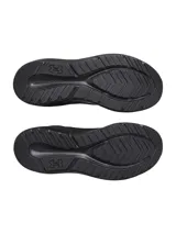 Championes de running Under Armour Charged Pursuit 4, color negro con logo blanco y suela blanca.