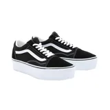 Zapatillas Vans Old Skool Stackform negras con la línea lateral blanca y suela de plataforma blanca.