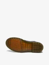 Botas Chelsea Dr. Martens modelo 2976, color negro, de cuero liso, con elástico lateral y tira trasera con el logo AirWair.