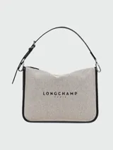Bolso Longchamp tipo tote, color crudo con detalles en negro y logo estampado.