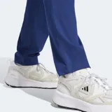 Pantalón deportivo Adidas de tejido spacer, color azul vibrante, con ajuste clásico, cintura elástica con cordón, bolsillos frontales y logo de las 3 Barras bordado en la cadera.