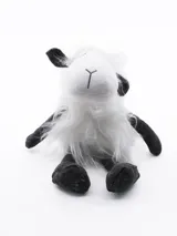 Oveja de peluche blanca con detalles en negro.