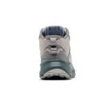 Botas de trekking de media caña Columbia Bethany Mid, color beige con detalles en gris y suela azul.