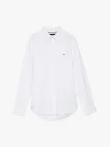Camisa blanca de popelín de puro algodón con Flex Technology, cuello inglés, puños redondeados con botones y logo de Tommy Hilfiger bordado en el pecho.