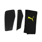 Canilleras Puma Attacanto de color amarillo flúor con detalles en negro. Incluyen mangas de sujeción negras con logo Puma en amarillo.