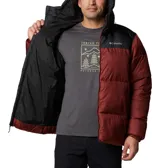 Campera puffer negra marca Columbia, con capucha ajustable, cierre frontal con cremallera, bolsillos laterales con cremallera, puños elásticos y aislamiento Thermarator™.