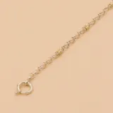 Pulsera de plata con eslabones tipo rolo y detalles de oro. Cierre marinero.