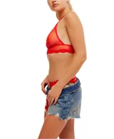 Bralette de malla transparente color celeste con ribete de encaje y espalda cruzada.