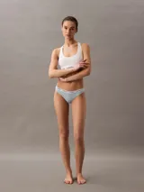 Colaless celeste de algodón elástico con cintura elástica blanca con logo Calvin Klein.