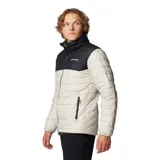 Campera puffer Columbia Powder Lite II, color beige con canesú negro, cierre frontal completo, bolsillos laterales con cierre y logo de la marca bordado en el pecho.