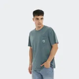 Remera de hombre Reef color azul, corte oversize, con bolsillo en el pecho y logo estampado.