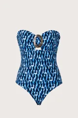 Traje de baño entero bandeau azul y negro con diseño de destellos blancos, escote en V, avío dorado central, breteles removibles y ajustables, espalda alta y cobertura media.