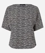 Blusa de crepé con estampado de cuadros pied-de-poule, cuello redondo y mangas cortas.