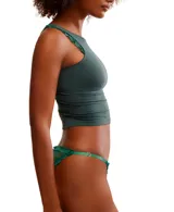 Bombacha de bikini color crema con lunares blancos, de corte colaless y cintura con elástico fino y detalle de puntilla.