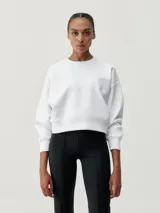 Buzo blanco de tejido técnico muy confortable con logo en relieve en el pecho y estilo holgado.