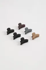 Set de seis pinzas para el pelo tipo clip, en colores negro, marrón, gris y beige.