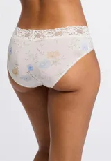 Panty corte hipster de lycra blanca con estampado floral y borde de encaje.