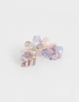 Broche para el pelo de resina con forma ondulada y diseño multicolor en tonos pastel.