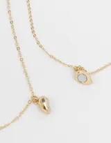 Set de dos collares dorados con cadena fina y dije de corazón partido que se une con imán.