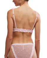 Conjunto de ropa interior Free People color verde esmeralda, compuesto por un top corto de punto canalé con ribete de encaje en los tirantes y una tanga transparente con lunares y ribete de encaje. Elástico ajustable en los laterales.