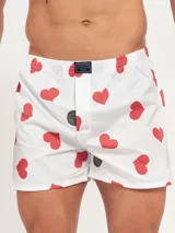 Bóxer de algodón con estampado floral en tonos azul y blanco, con cintura elástica y logo de la marca en el centro.