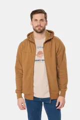 Canguro con cierre y capucha color bordó, confeccionado en felpa de algodón y poliéster.