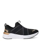 Championes Puma Softride Harli Slip On, color negro con detalles dorados y suela blanca. Diseño slip-on con bandas elásticas cruzadas en el empeine y logo de Puma en dorado.