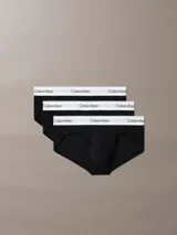 Pack de tres slips negros de algodón con cintura elástica blanca con el logo de Calvin Klein.