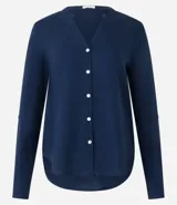 Camisa amarilla de viscolino con escote en pico, manga larga y botonadura frontal.