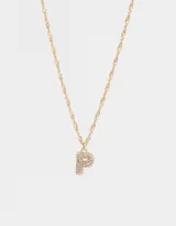 Cadena corta dorada con dije de la letra A cubierto de strass.