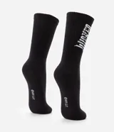 Medias de caña alta negras con estampa de letras blancas con la palabra "WICKED".