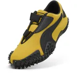 Championes Puma Mostro OG Prime, color amarillo con detalles en negro y suela con tacos.