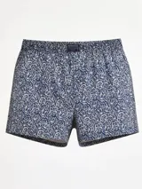 Bóxer de algodón azul marino con estampado floral en blanco y azul claro. Posee cintura elástica con etiqueta de marca en el centro.